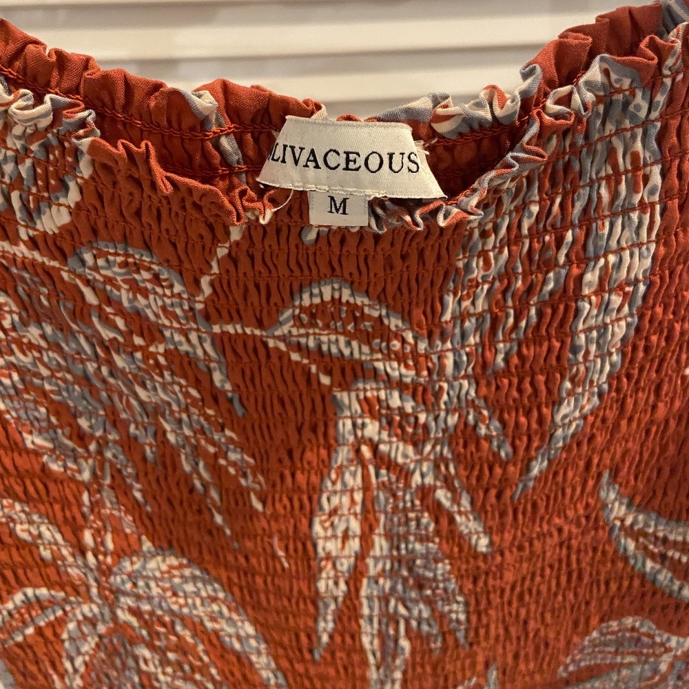 Olivaceous Orange Flare Leg Jumpsuit - Size Medium (never worn)